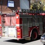 Fire Truck struggling to find room between illegally parked cars in front of Brentwood Library.