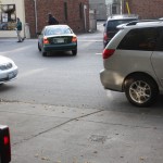 Illegally parked cars frequently blocking driveways.