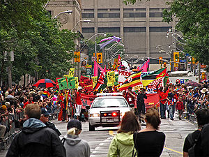Pride Parade turning off Yonge Street onto Ger...